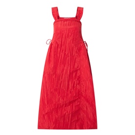 Damson Madder red sleeveless midi dress with square neckline, wide straps, side tie detail and textured crinkle fabric finish.