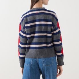 Model wearing Damson Madder Didi Layered Striped Cardigan in Argyle/Stripe, grey, navy and red, rear view, styled with blue jeans