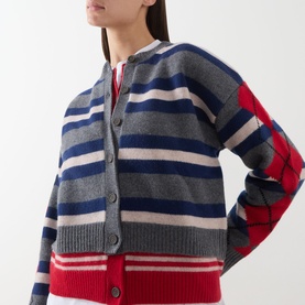 Model wearing Damson Madder Didi Layered Striped Cardigan in Argyle/Stripe, grey, blue and red merino wool with button front and ribbed trims