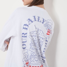 Model wearing Damson Madder white oversized cotton T-shirt, back view showing illustrated burger and characters graphic print with red and blue text