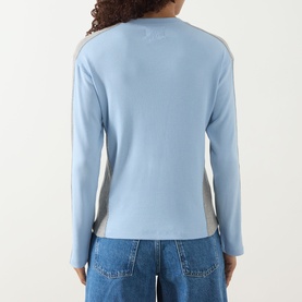 Model wearing Damson Madder blue long-sleeve cotton T-shirt, back view, with contrast side panels and embroidered logo detail