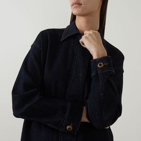 Model wearing Elena Miro Patch Pocket Denim Overshirt in dark blue with point collar, tobacco stitching, and buttoned cuffs