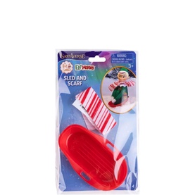 Elf on a Shelf red miniature sled and red and white striped scarf set, shown in retail packaging