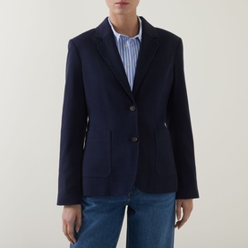 Model wearing Gant Single-Breasted Piqu&eacute; Blazer in blue, notched lapels, button fastening, patch pockets, styled with blue striped shirt and jeans.