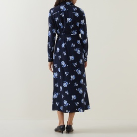 Model wearing Gant blue floral print midi dress with long sleeves and belted waist, shown from the back