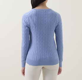 Model wearing Gant Shield Logo Cable Knit Sweater in Misty Lavender, back view showing cable knit pattern and ribbed trims, styled with cream