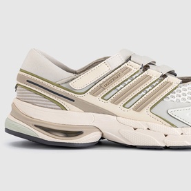 Adidas trainer in Wonder White and Wonder Beige with mesh panels, three-stripe detail, and chunky moulded sole