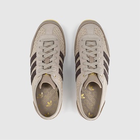 Adidas trainers in Wonder Beige and Dark Brown, suede upper with three stripe detail, cream gum sole, floral insole visible, overhead shot
