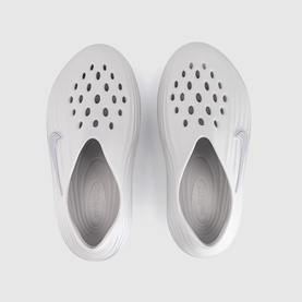 Nike Vast Grey slip-on clogs with perforated toe box, swoosh logo detail, top-down view showing moulded footbed