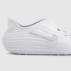 Nike Vast Grey clog-style slide with ribbed upper detailing and silver swoosh logo, white sole