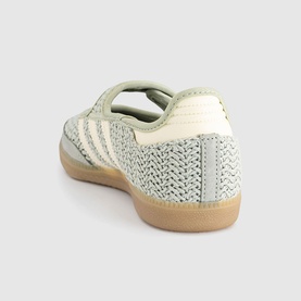 Adidas trainer in Halo Green and Warm Vanilla, textured knit upper, cream three-stripe detail, gum rubber sole, heel view