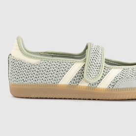Adidas trainer in Halo Green and Warm Vanilla, knit upper with velcro strap, cream three stripes, gum sole.
