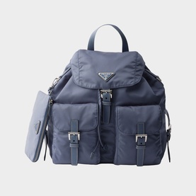 Prada Accessories blue nylon backpack with silver-tone hardware, front buckle pockets, drawstring closure, and detachable pouch