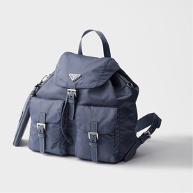 Prada Accessories blue nylon backpack with silver hardware, front buckle pockets, drawstring flap closure, and top carry handle.