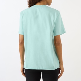 Model wearing Adanola Logo Graphic Oversized T-Shirt in Ocean Blue, back view, round neck, short sleeves, paired with black leggings.