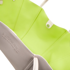 Anxious Preoccupied The Oversized Logo Tote Bag in beige with lime green interior, showing open top, snap-button closure and accordion sides.