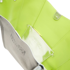 Anxious Preoccupied The Oversized Logo Tote Bag in silver with lime green interior, snap-button closure and debossed logo branding visible