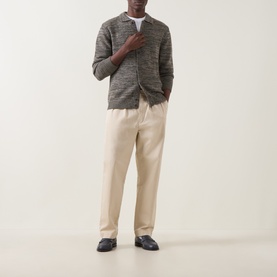Model wearing Aspesi Textured Knitted Polo Cardigan in Military, styled with cream trousers and white tee, dark loafers.