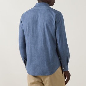 Model wearing Aspesi light blue cotton casual shirt, rear view, styled with beige chinos