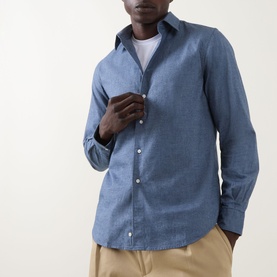 Model wearing Aspesi light blue cotton casual shirt with spread collar and button placket, styled with beige trousers