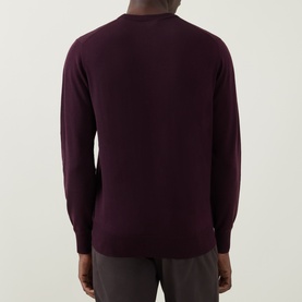 Model wearing Aspesi Fine-Knit Sweater in burgundy wool, crew neck, long sleeves and ribbed trims, rear view.