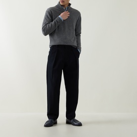 Model wearing Aspesi Solid Half-Zip Sweater in grey with funnel neck, styled with black wide-leg trousers and dark loafers.