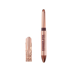 Charlotte Tilbury Exagger-Eyes Eyeshadow Stick in Oyster Twilight, rose gold barrel with cap shown alongside pencil