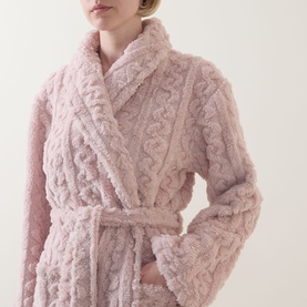 Model wearing Gingerlilly Gabriella Plush Long Robe in Gabriella Pink, featuring cable-knit pattern, shawl collar and self-tie belt