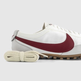 Nike Moon Shoe Trainers in Summit White with Team Crimson leather Swoosh, cream flat laces and tan waffle rubber sole.
