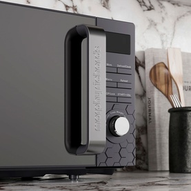 Morphy Richards Cassini 20L 800w Black Microwave, close-up of control panel with dial, hexagonal detail, on kitchen counter