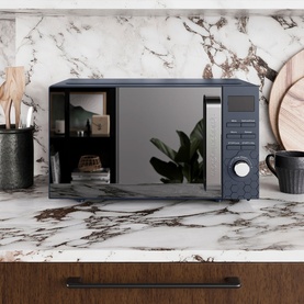Morphy Richards Cassini 20L 800w Navy Microwave on marble kitchen counter, styled with wooden utensils and stacked plates