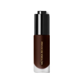Victoria Beckham Colour Wash Bronze Water Tint in Tanline, deep bronze liquid formula in sleek black pump bottle