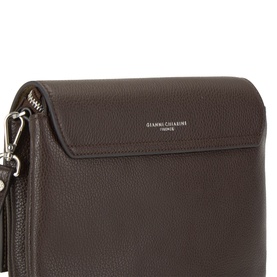 Gianni Chiarini brown leather crossbody bag with silver-tone hardware, tassel zip detail and flap closure, close-up view.
