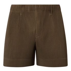 Issey Miyake Genova Metal Ocher pleated shorts in ribbed polyester with elasticated waistband and tailored silhouette.