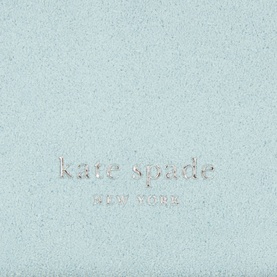 Kate Spade Loop Suede Zip Cardholder in English Sea, close-up of pale blue suede surface with embossed silver-tone logo detail