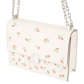 Kate Spade cream multi leather crossbody bag with red floral print, silver chain strap, and structured front flap with geometric clasp