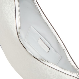 Kate Spade True White leather crossbody bag, interior view showing smooth lining, zip pocket and card slot detail with silver hardware.