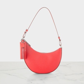 Kate Spade Duo Mini Shoulder Bag in Heirloom Tomato pebbled leather, crescent shape, silver-tone hardware, detachable strap and tassel keychain