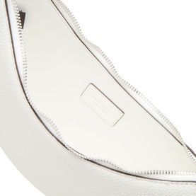 Kate Spade True White leather shoulder bag interior view, showing smooth lining, zip closure, and embossed logo patch
