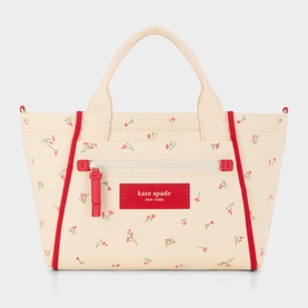 Kate Spade Dash Floral Canvas Tote Bag in Cream Multi with red trim, cherry print, front zip pocket, and carry handles