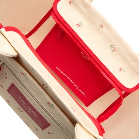 Kate Spade Dash Floral Canvas Tote Bag in Cream Multi, open top view showing red zip interior, floral lining, and multiple compartments