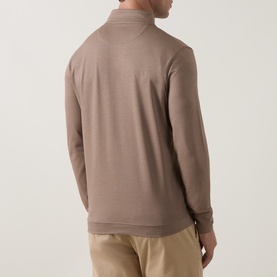 Model wearing Peter Millar Half Zip in Light Mocha, rear view, styled with beige trousers