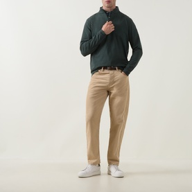 Model wearing Peter Millar Pine Brook sweat with quarter-zip collar, styled with beige chinos and white trainers.