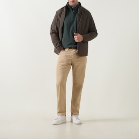 Model wearing Peter Millar Pine Brook sweatshirt, styled with dark brown zip jacket, beige chinos and white trainers.