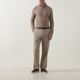 Model wearing Peter Millar Sawgrass long-sleeve polo, styled with taupe chinos, brown belt and dark suede loafers
