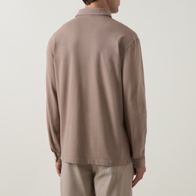 Model wearing Peter Millar sweatshirt in Sawgrass, shown from behind, with long sleeves and a collar, styled with matching taupe trousers.