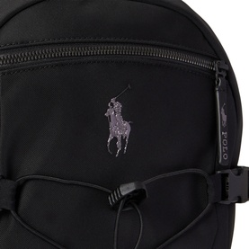 Ralph Lauren black backpack close-up showing tonal purple pony logo, zip pocket, bungee cord detail and branded zip pull.