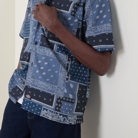 Model wearing Dickies dark navy bandana patchwork short-sleeve casual shirt, styled with dark blue jeans
