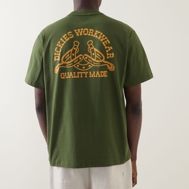 Model wearing Dickies Cypress green crew neck T-shirt, back view showing orange Dickies Workwear Quality Made graphic print.