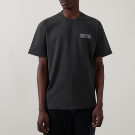 Model wearing Dickies Buchtell Logo T-Shirt in black, featuring small chest logo, crew neck and short sleeves in 100% cotton.